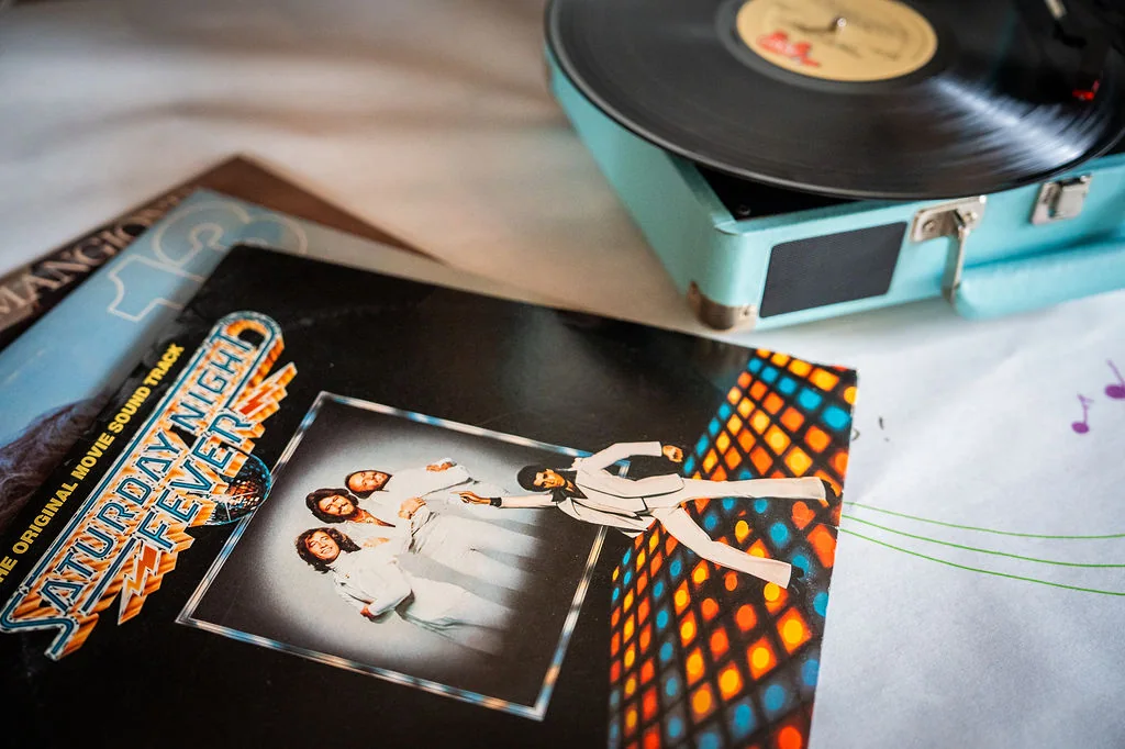 A record player and a vinyl album in the retreat lounge