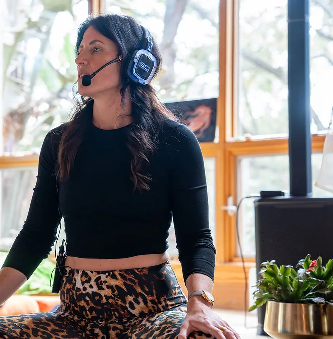 Sarah guiding a journey through a headset microphone