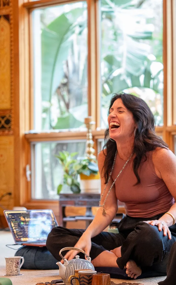 Sarah laughing during a healing circle